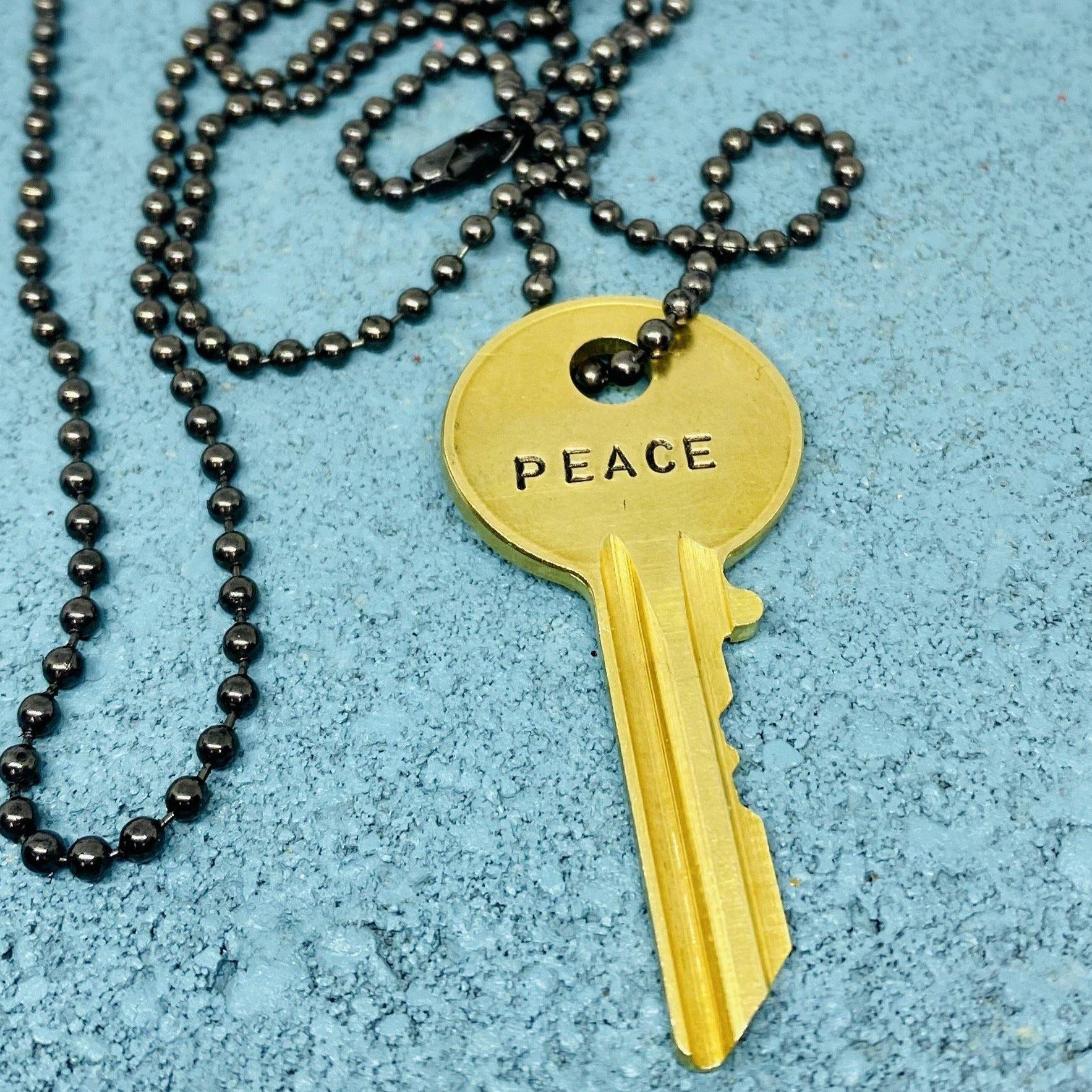 Peace Kingdom Key Necklace